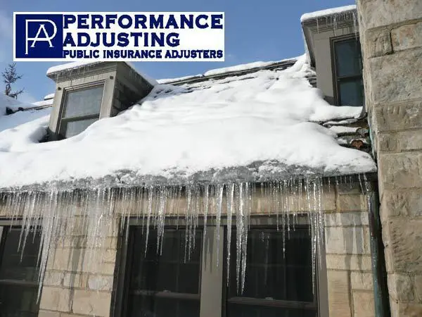 ice dam on a snow covered roof