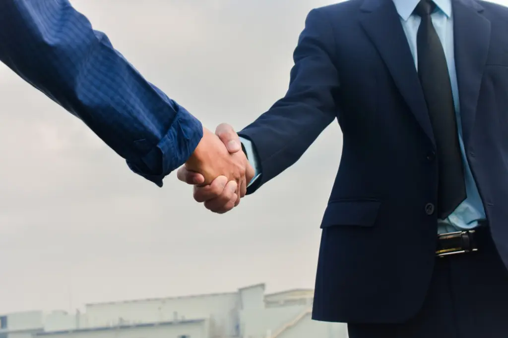 Business handshake with a public adjuster