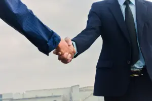 Business handshake with a public adjuster