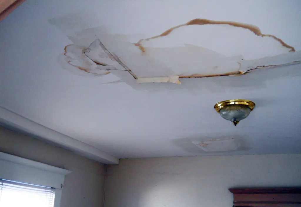 a ceiling with a lot of water damage all over it